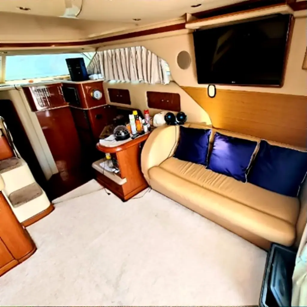 Yacht saloon with sofa, TV and air conditioning